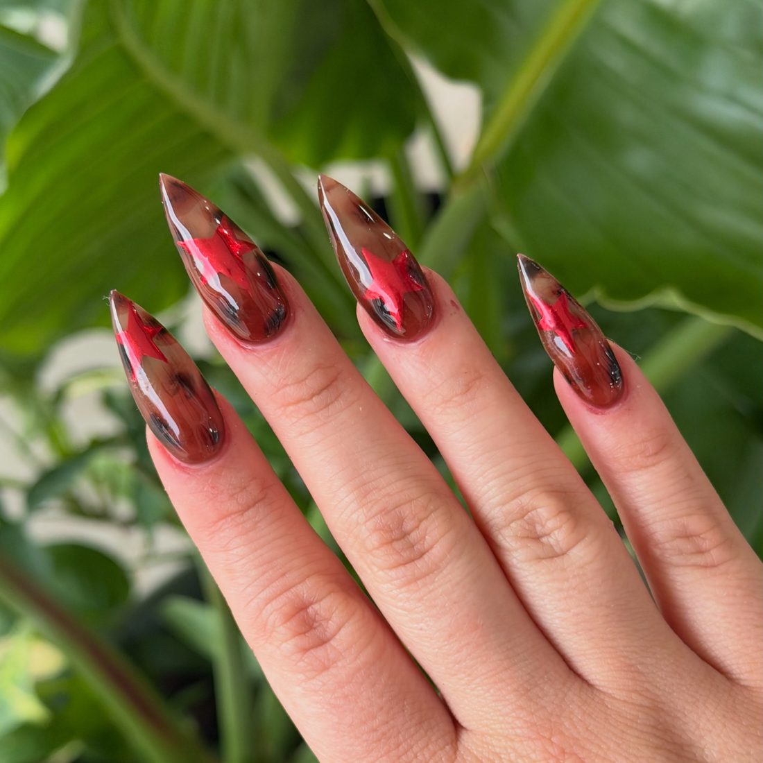 red and black nail art nails, stiletto shape — nail salon in Calhoun, GA — Sonny & Tee