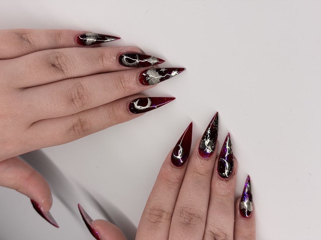 red and black chrome nails, stiletto shape — nail salon in Rome, GA — Sonny & Tee